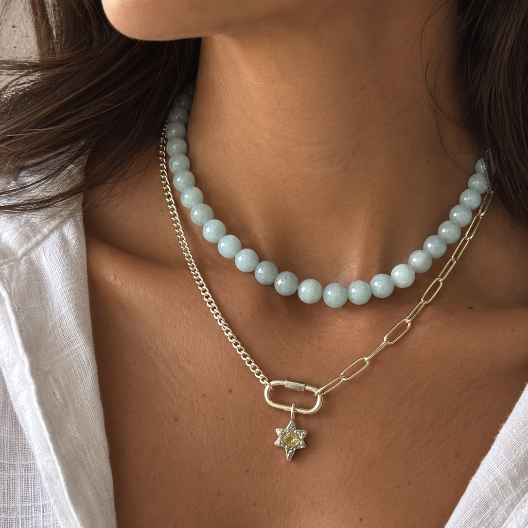 HOUSE OF EVEN Eclipse connector necklace featuring mixed silver-tone chains and a star charm on a model